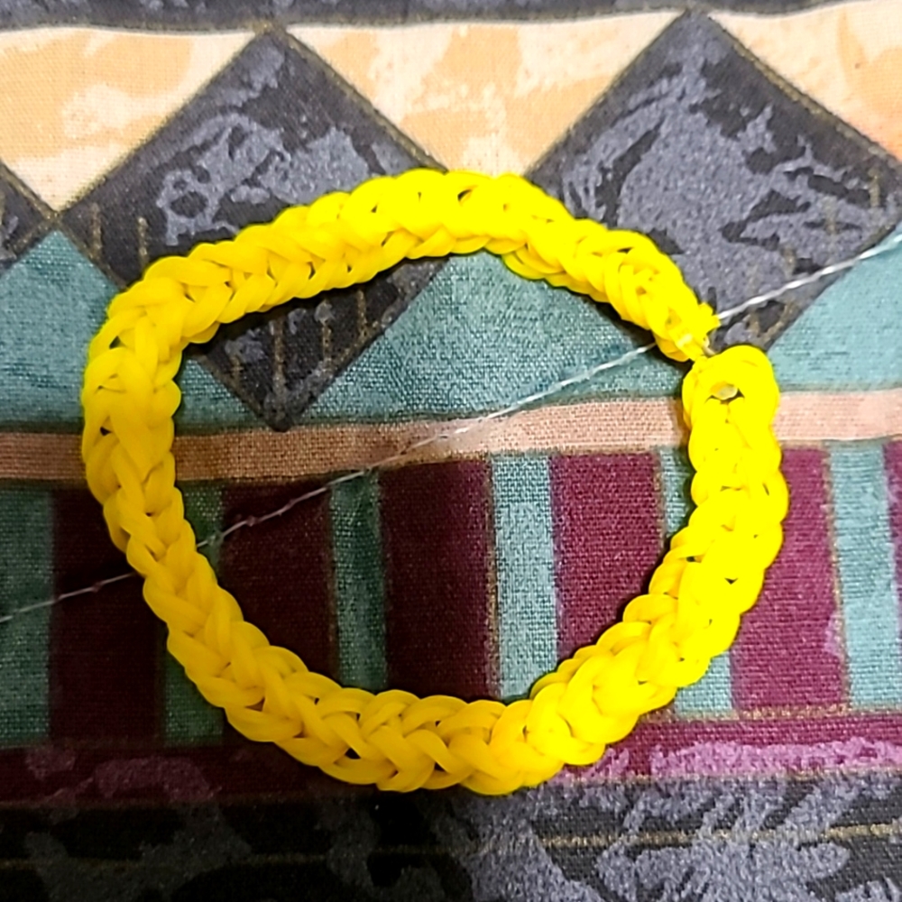 A ladies size small rainbow loom band bracelet.
